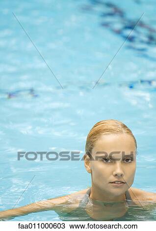 Woman in pool, looking at camera View Large Photo Image Stock Image - Woman in pool, looking at camera. Fotosearch