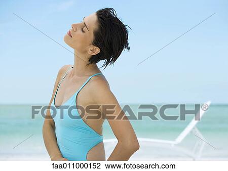 Woman on beach, head back and eyes closed View Large Photo Image Stock Image - Woman on beach, head back and eyes closed. Fotosearch
