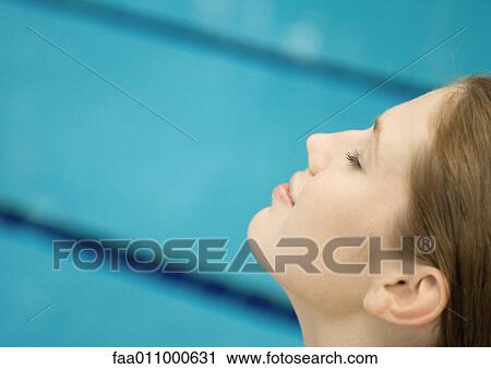 Woman smiling, close-up of side view of face, pool in background View Large Photo Image Stock Image - Woman smiling, close-up of side view of face, pool in background. Fotosearch