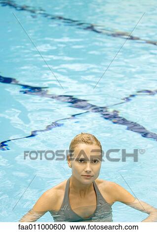 Woman standing in pool, looking at camera View Large Photo Image Stock Image - Woman standing in pool, looking at camera. Fotosearch