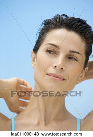 Woman with hands behind head, head and shoulders, portrait View Large Photo Image Stock Photo - Woman with hands behind head, head and shoulders, portrait. Fotosearch