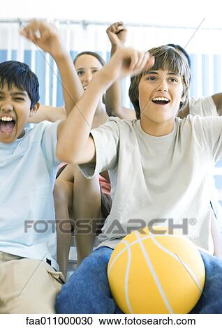 Young teens with basketball shouting View Large Photo Image Stock Image - Young teens with basketball shouting . Fotosearch