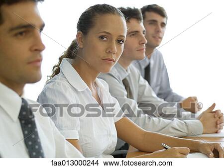 Business colleagues having meeting, focus on woman View Large Photo Image Picture - Business colleagues having meeting, focus on woman. Fotosearch