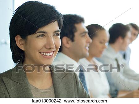 Business colleagues having meeting, focus on woman in foreground View Large Photo Image Stock Image - Business colleagues having meeting, focus on woman in foreground. Fotosearch