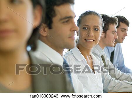 Business colleagues having meeting, focus on woman View Large Photo Image Stock Image - Business colleagues having meeting, focus on woman. Fotosearch