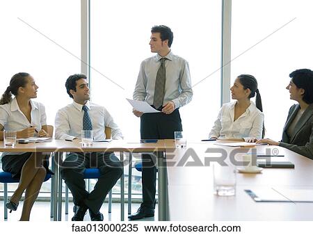 Stock Photography - Business colleagues having meeting. Fotosearch