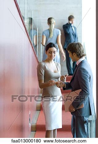 Businessman and woman exchanging business card View Large Photo Image Stock Image - Businessman and woman exchanging business card. Fotosearch