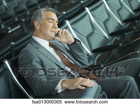 Businessman sleeping in airport lounge View Large Photo Image Stock Photography - Businessman sleeping in airport lounge. Fotosearch