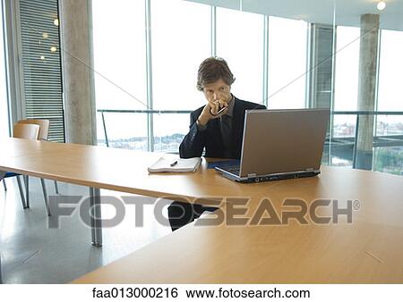 Businessman working with laptop View Large Photo Image Stock Photograph - Businessman working with laptop. Fotosearch