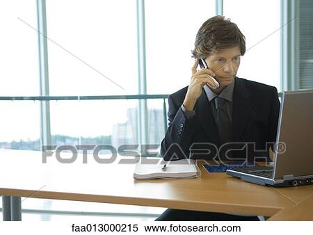 Businessman working with laptop View Large Photo Image Stock Photography - Businessman working with laptop. Fotosearch