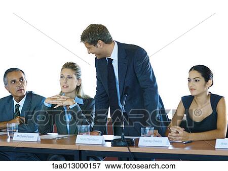 Businesspeople in committee meeting, one man standing View Large Photo Image Stock Photo - Businesspeople in committee meeting, one man standing. Fotosearch