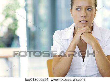 Businesswoman with hands clasped under chin, portrait View Large Photo Image Stock Image - Businesswoman with hands clasped under chin, portrait. Fotosearch
