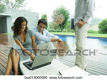 Casually dressed executives working by side of pool View Large Photo Image Stock Image - Casually dressed executives working by side of pool. Fotosearch