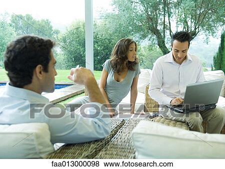 Casually dressed executives working by side of pool View Large Photo Image Stock Photo - Casually dressed executives working by side of pool. Fotosearch