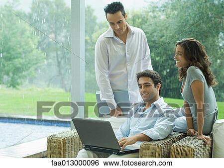Casually dressed executives working by side of pool View Large Photo Image Stock Photograph - Casually dressed executives working by side of pool. Fotosearch