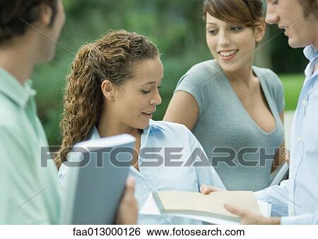 Casually dressed young executives working outdoors View Large Photo Image Stock Photograph - Casually dressed young executives working outdoors. Fotosearch