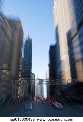 Chicago street lined with skyscrapers, blurred motion View Large Photo Image Stock Photo - Chicago street lined with skyscrapers, blurred motion. Fotosearch