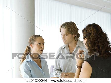 Executives having conversation View Large Photo Image Stock Image - Executives having conversation. Fotosearch