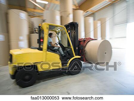 Stock Image - Fork lift carrying roll of paper. Fotosearch