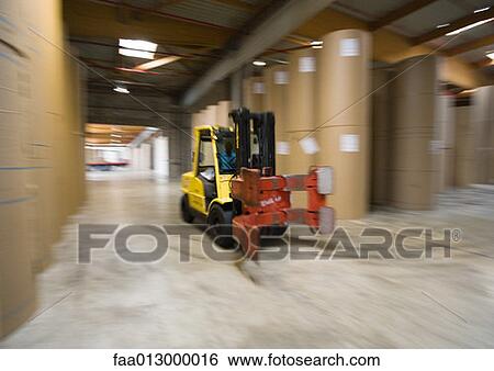 Fork lift in paper mill stockage area View Large Photo Image Stock Photograph - Fork lift in paper mill stockage area. Fotosearch