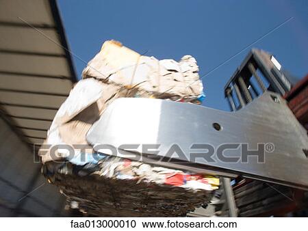 Forklifting transporting bales of used paper View Large Photo Image Stock Image - Forklifting transporting bales of used paper. Fotosearch