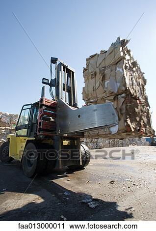Forklifting transporting bales of used paper View Large Photo Image Stock Image - Forklifting transporting bales of used paper. Fotosearch