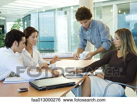 Stock Photograph - Group of executives working together. Fotosearch