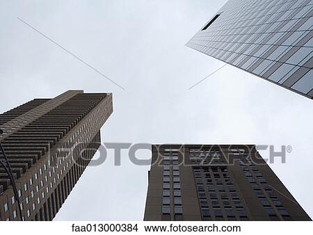 High rise buildings, low angle view View Large Photo Image Picture - High rise buildings, low angle view. Fotosearch