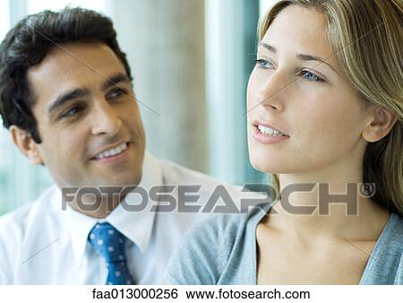 Stock Photograph - Male and female executive collegues. Fotosearch
