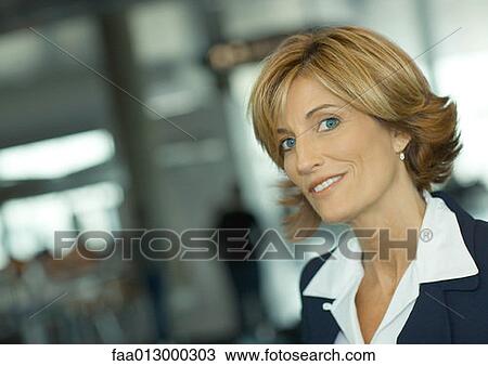 Mature woman smiling at camera, portrait View Large Photo Image Stock Image - Mature woman smiling at camera, portrait. Fotosearch