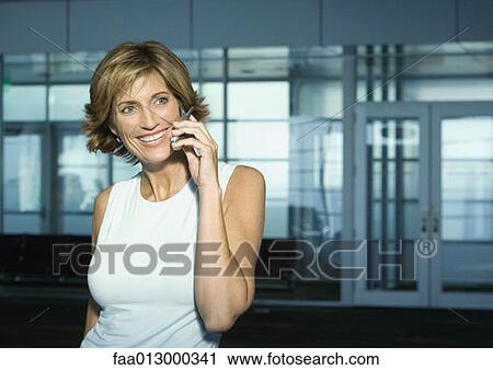 Mature woman using cell phone View Large Photo Image Stock Image - Mature woman using cell phone. Fotosearch