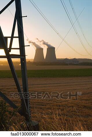 Nuclear cooling towers at sunset View Large Photo Image Stock Photo - Nuclear cooling towers at sunset. Fotosearch