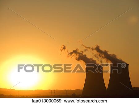 Stock Photo - Nuclear cooling towers at sunset. Fotosearch