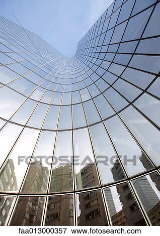 Skyscraper with reflection of buildings on facade, low angle, abstract view View Large Photo Image Stock Photo - Skyscraper with reflection of buildings on facade, low angle, abstract view. Fotosearch