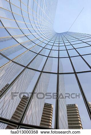 Skyscraper with reflection of buildings on facade, low angle, abstract view View Large Photo Image Stock Photo - Skyscraper with reflection of buildings on facade, low angle, abstract view. Fotosearch