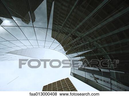 Skyscraper with reflection of buildings on facade, low angle, abstract view View Large Photo Image Stock Photo - Skyscraper with reflection of buildings on facade, low angle, abstract view. Fotosearch