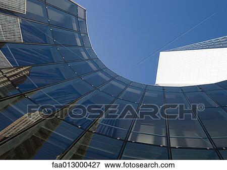 Skyscraper with reflection of buildings on facade, low angle, abstract view View Large Photo Image Stock Photo - Skyscraper with reflection of buildings on facade, low angle, abstract view. Fotosearch