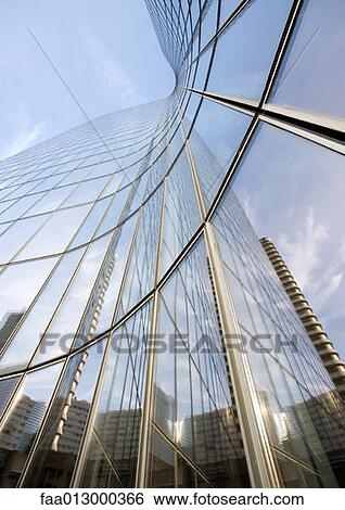 Skyscraper with reflection of buildings on facade, low angle, abstract view View Large Photo Image Stock Photograph - Skyscraper with reflection of buildings on facade, low angle, abstract view. Fotosearch