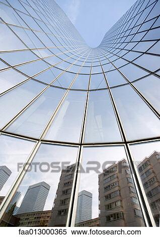 Skyscraper with reflection of buildings on facade, low angle, abstract view View Large Photo Image Stock Photography - Skyscraper with reflection of buildings on facade, low angle, abstract view. Fotosearch