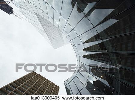 Skyscraper with reflection of buildings on facade, low angle, abstract view View Large Photo Image Stock Photography - Skyscraper with reflection of buildings on facade, low angle, abstract view. Fotosearch
