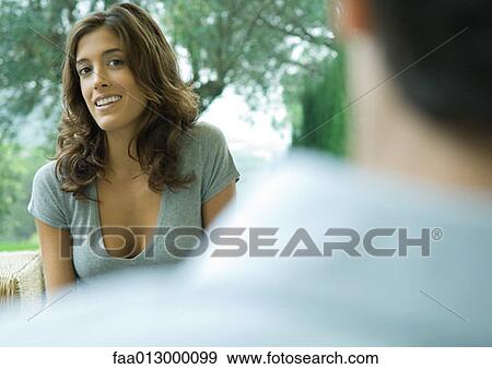 Stock Photo - Woman looking at man. Fotosearch