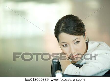 Woman resting head on back of seat View Large Photo Image Stock Photo - Woman resting head on back of seat. Fotosearch