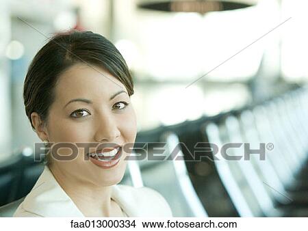 Woman sitting in airport lounge View Large Photo Image Picture - Woman sitting in airport lounge. Fotosearch