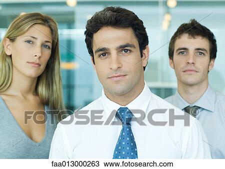 Young executives, looking at camera, portrait View Large Photo Image Stock Image - Young executives, looking at camera, portrait. Fotosearch