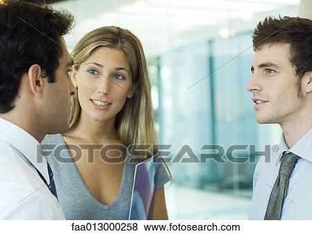 Young executives talking View Large Photo Image Stock Photo - Young executives talking. Fotosearch