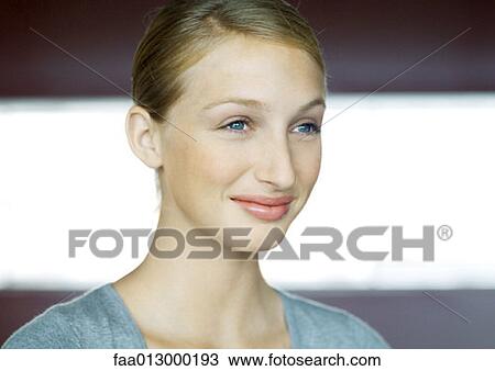 Young woman smiling, portrait View Large Photo Image Stock Image - Young woman smiling, portrait. Fotosearch