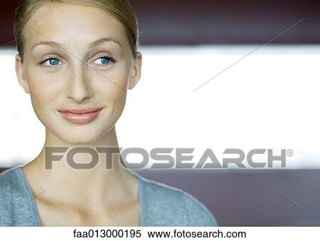 Stock Photography - Young woman smiling, portrait. Fotosearch