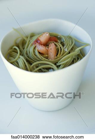 Stock Photo - Bowl of pesto pasta . Fotosearch