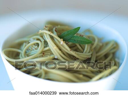 Bowl of pesto pasta View Large Photo Image Stock Photo - Bowl of pesto pasta . Fotosearch