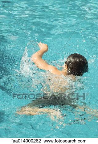 Boy splashing in pool View Large Photo Image Stock Image - Boy splashing in pool. Fotosearch